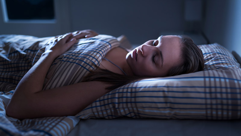 Woman in Deep Sleep at Night
