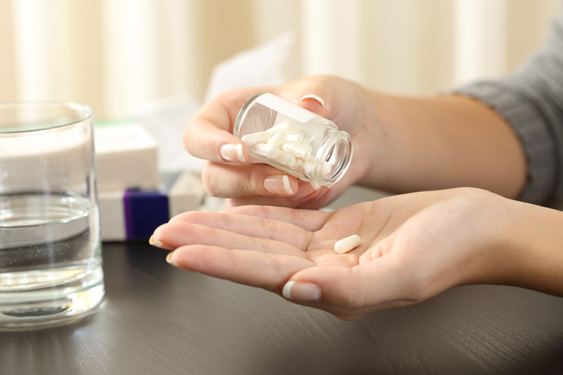 Woman Taking Nerve Health Supplement